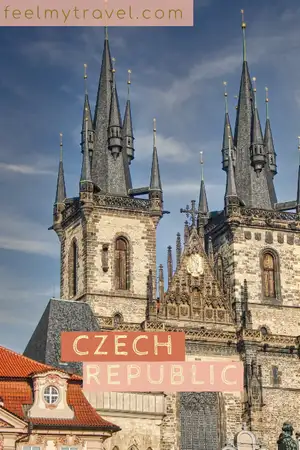 Gothic spires of the Church of Our Lady before Tyn rising above red rooftops in Prague, Czech Republic