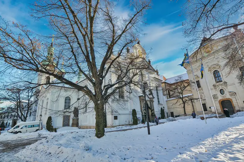 Strahov Monastery church seen through winter trees in Prague