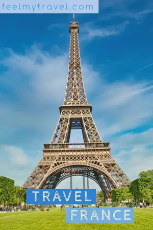 The Eiffel Tower rising above the green lawns of the Champ de Mars in Paris, France
