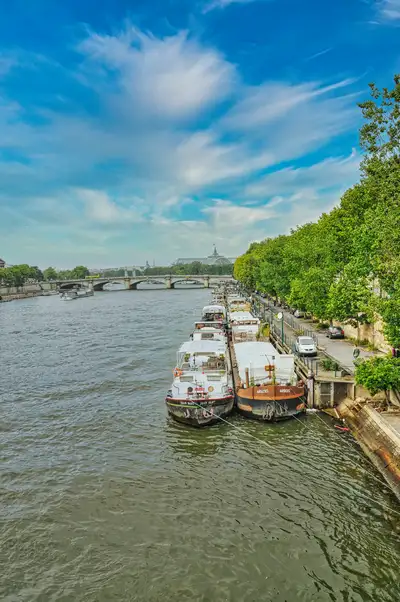 Houseboats moored along the banks of the Seine in Paris