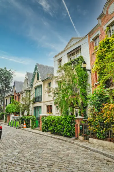 Green houses along an old lane in Montmartre in Paris