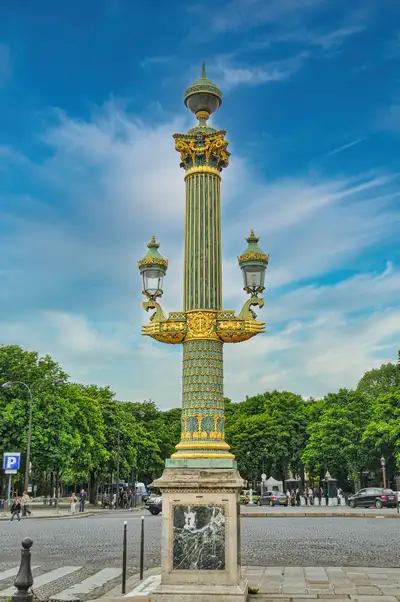 A decorated green and gold street lamp near the Champs-Élysées in Paris