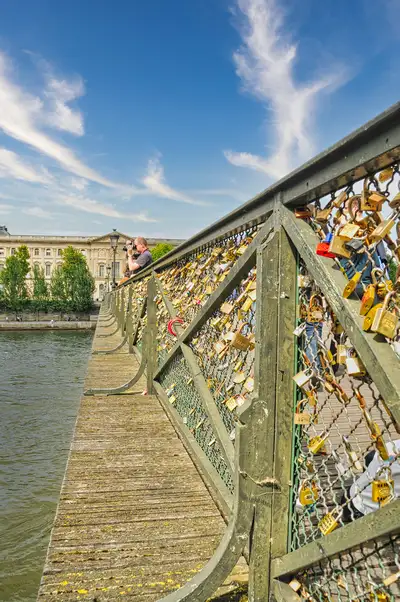 Padlocks covering the railings of the Pont des Arts footbridge over the Seine in Paris