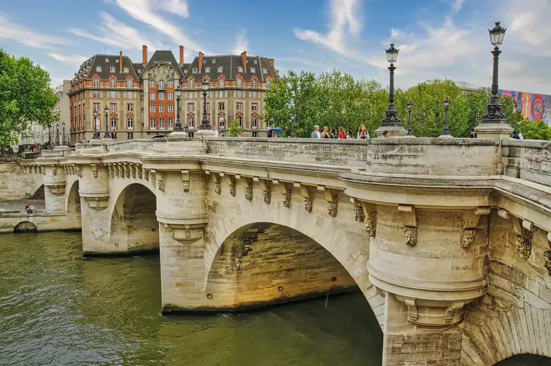 The old Pont Neuf with its round bastions and lamps in Paris