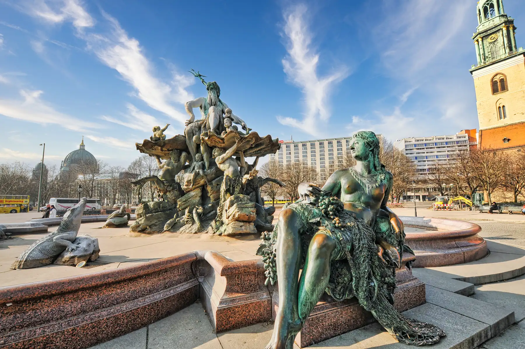The Neptune Fountain with the Berlin Cathedral dome and St. Mary's Church behind in Mitte
