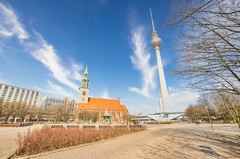 St. Mary's Church and the TV Tower side by side near Alexanderplatz in Berlin