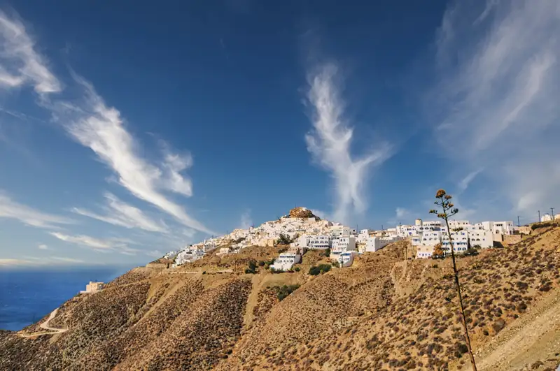 Panoramic view of Anafi Chora village perched on a hilltop above the Aegean Sea