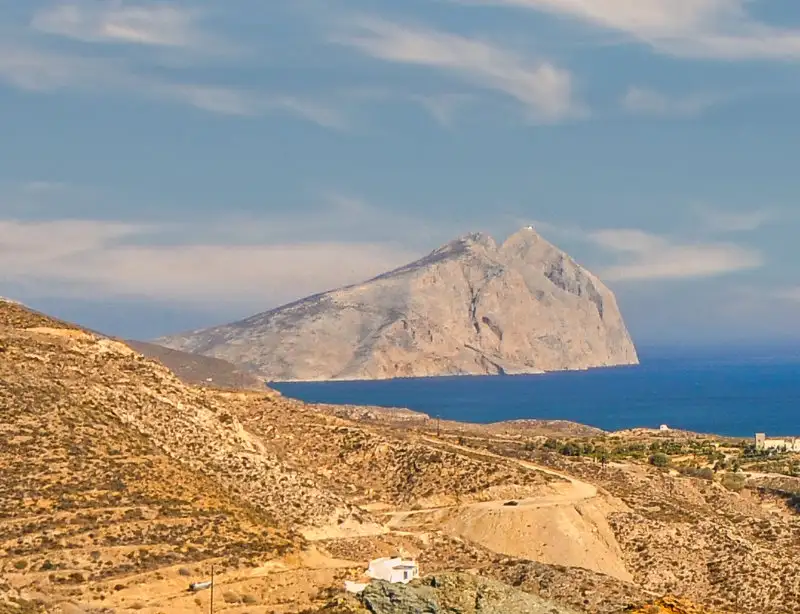Kalamos rock in Anafi, one of the largest monoliths in the Mediterranean, rising dramatically from the Aegean Sea