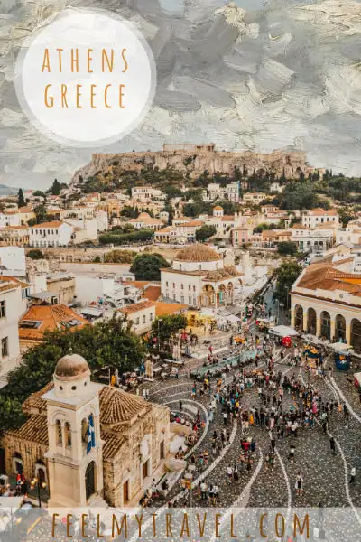 View of Monastiraki Square and the Acropolis in Athens with crowds gathering below ancient and Byzantine landmarks