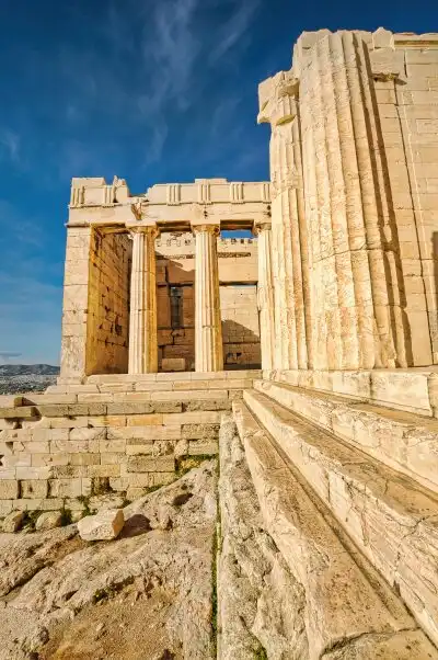 Temple ruins and columns at the Propylaea gates on the Acropolis of Athens