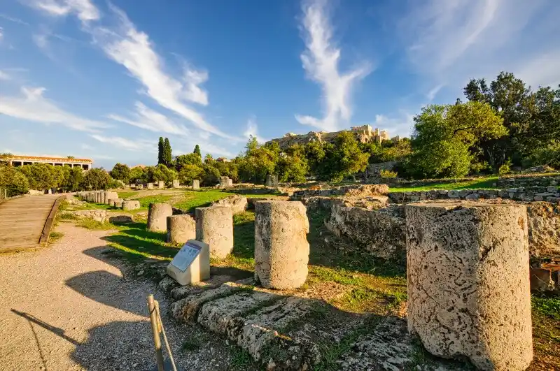 Ruins of the Ancient Agora of Athens with the Acropolis visible in the background