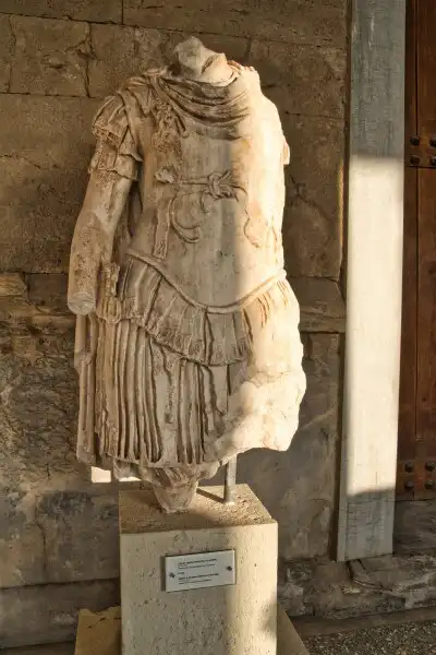 Headless Roman marble statue displayed inside the Ancient Agora Museum in Athens