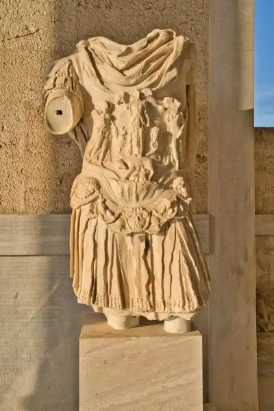 Detailed marble torso of a Roman statue inside the Ancient Agora of Athens