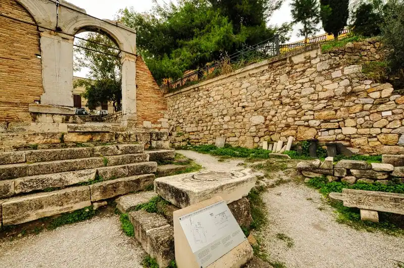 Roman Agora Athens Agoranomion arch ruins stone steps archaeological site Greece
