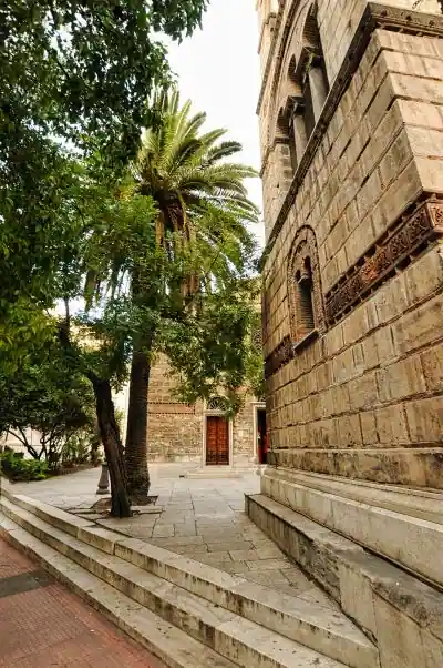 Sotira Lykodimou Church Athens side view palm tree courtyard Byzantine Orthodox church Greece