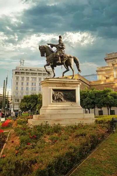 Bronze equestrian statue of Theodoros Kolokotronis on Kolokotronis Square in Athens with the National Historical Museum in the background