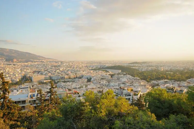 Sunset view from Lycabettus Hill looking west over Athens toward Piraeus and the sea