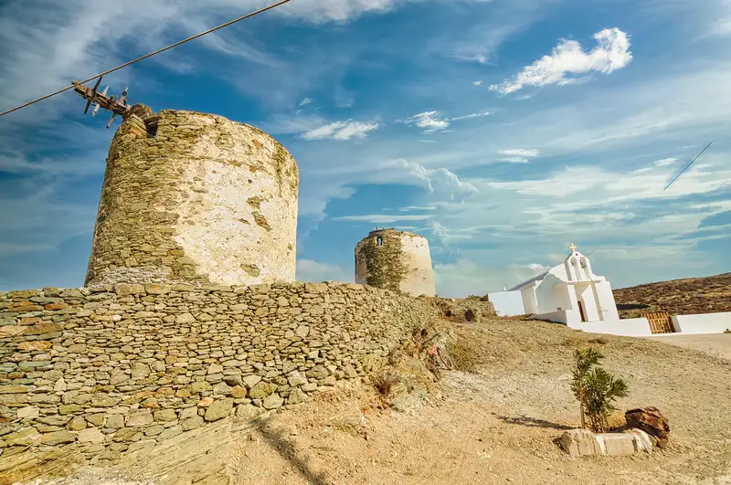 Ano Meria village in Folegandros with old stone windmills and a small white chapel