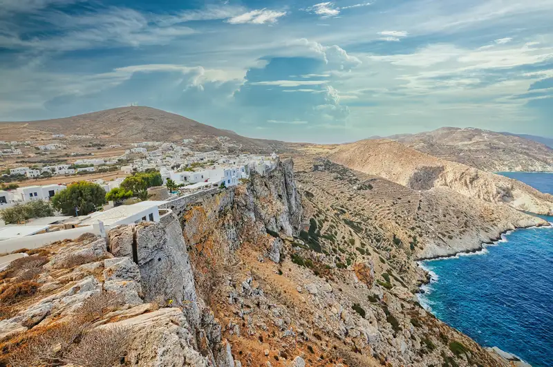 Panoramic view of Chora Folegandros perched on dramatic cliffs above the sea