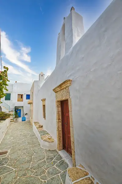 Kastro church in Folegandros with a stone-carved door and whitewashed walls