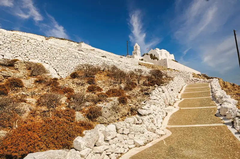Panagia church folegandros island reached by a stone path climbing up the hillside