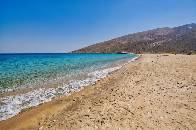 Agia Theodoti beach on Ios island, a long sandy horseshoe bay on the east coast