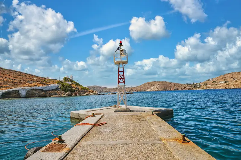 A pier extending into the sea at Gialos in Ios, with a small navigation beacon