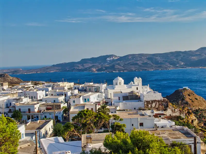 An aerial view of Plaka village with whitewashed houses and the central church