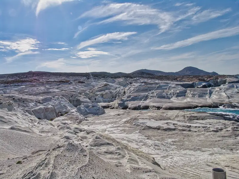 The lunar-like terrain of white volcanic rock formations at Sarakiniko on the north coast of Milos island