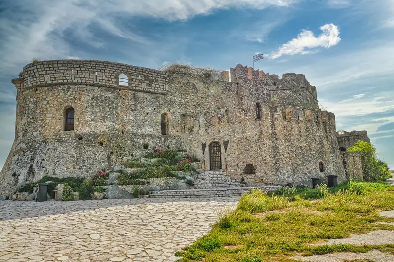 Exterior walls and Greek flag at Bourtzi fortress in Nafplio harbour