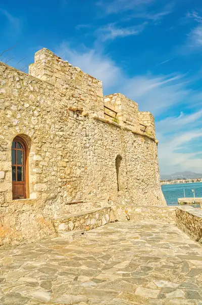 Stone walls and arched window of Bourtzi fortress in Nafplio