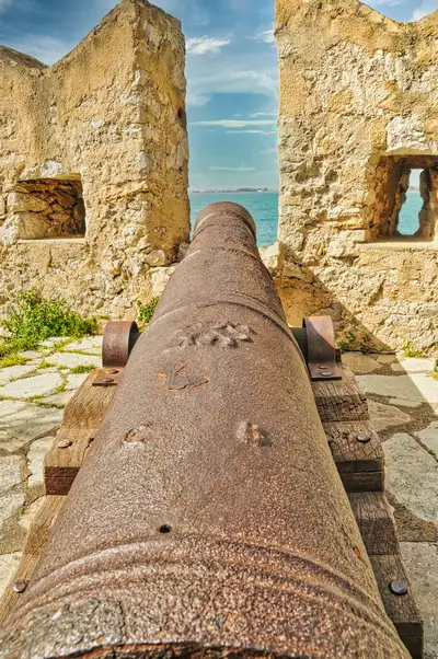 Old cannon pointing out to sea from inside Bourtzi fortress in Nafplio