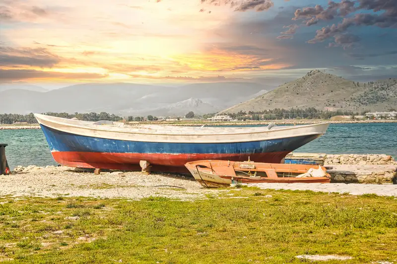 Old fishing boats on the shore near Nafplio in the Argolic Gulf