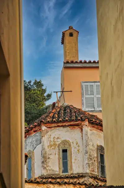 An old church glimpsed between buildings in the old town of Nafplio