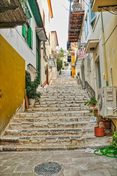 Steps leading up between traditional houses in Nafplio's old town