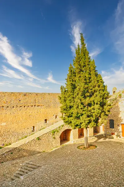 Inner courtyard of Palamidi fortress with a cypress tree, Nafplio