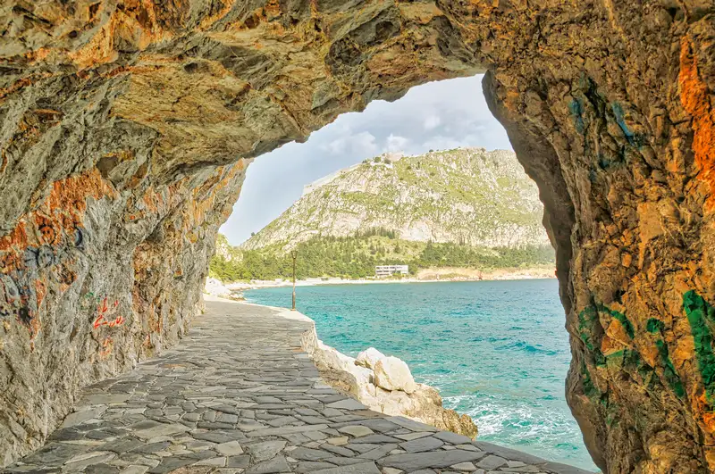 View through the stone tunnel on the Arvanitia promenade in Nafplio