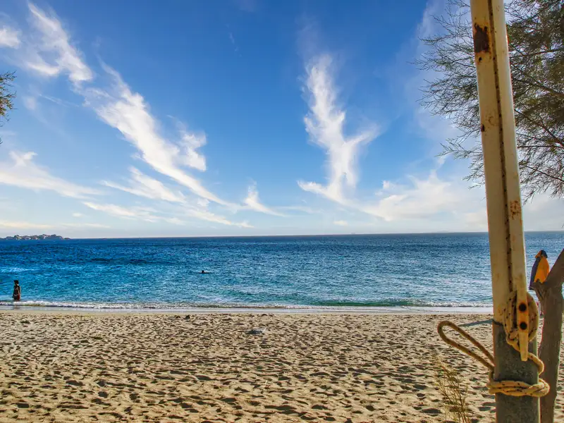 Sandy shore and clear water at Agia Anna beach on Naxos island