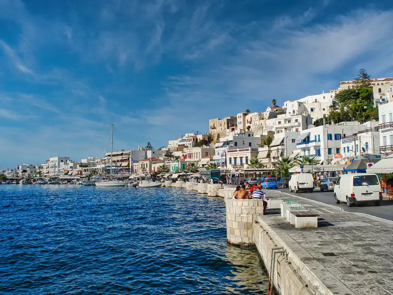 Waterfront of Naxos Town Chora with white houses climbing the hill