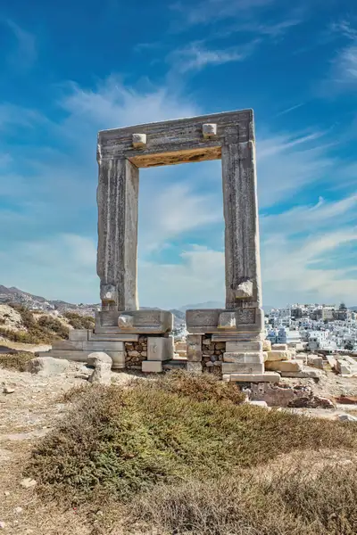 The Portara monument with Chora visible through the marble gate in Naxos