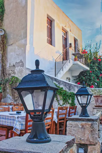 Lanterns and taverna tables ready for evening in Naxos Town