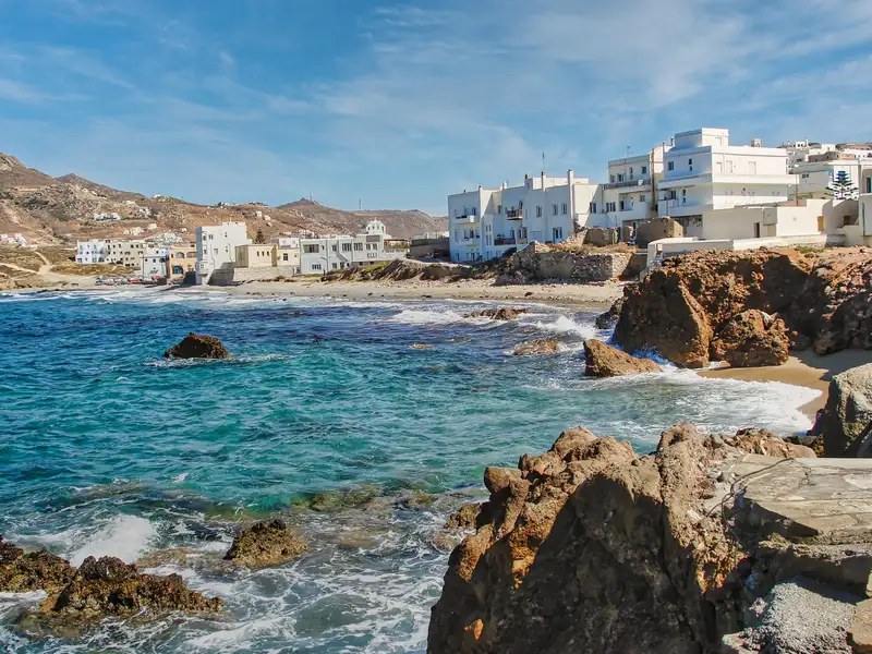 Turquoise water and rocky coastline near Chora Naxos