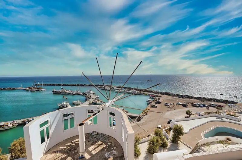 The marina and harbour at Vlychada on the southern tip of Santorini, seen from a windmill