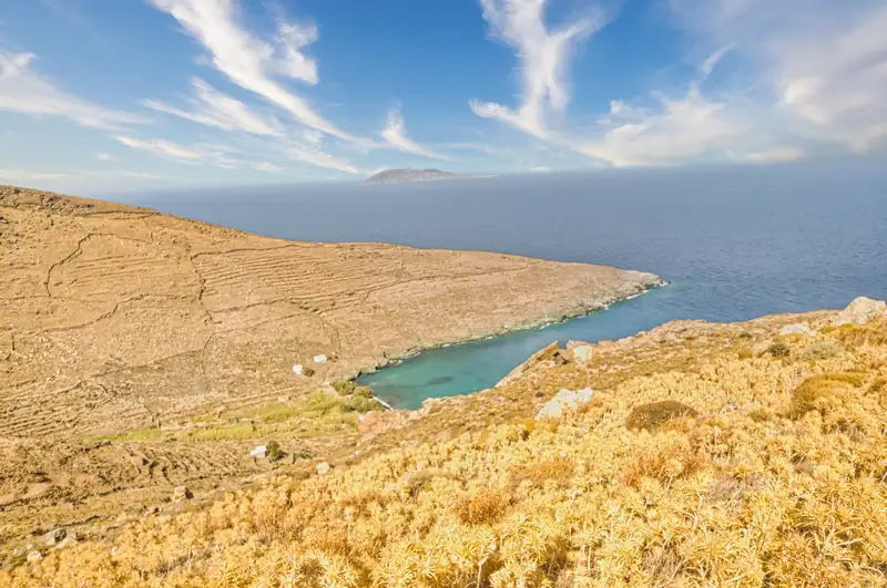 Secluded bay below terraced slopes near Kentarchos village, Serifos