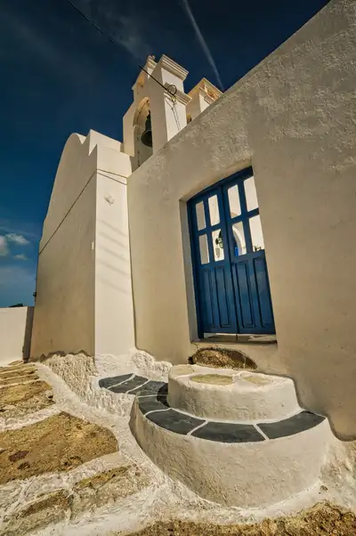 Hilltop chapel and whitewashed steps above the lichen-covered rock of Serifos