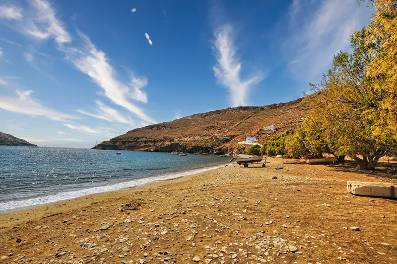 Quiet pebbled bay of Koutalas backed by hills in Serifos