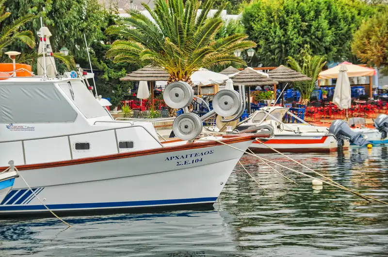 Fishing boats moored before the waterfront tavernas of Livadi, Serifos