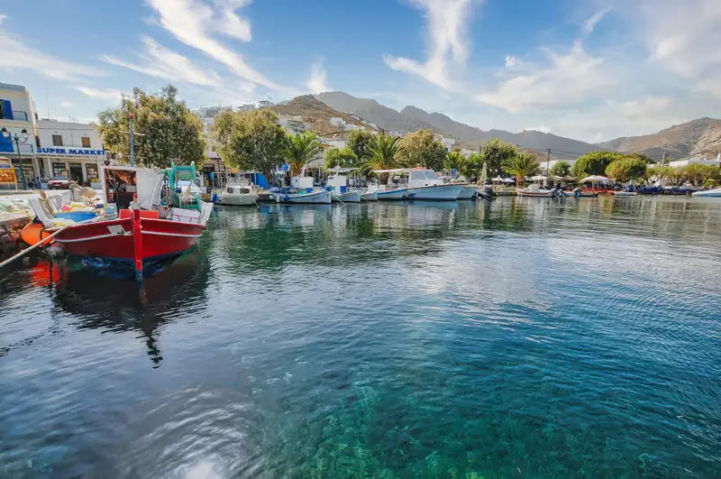Fishing boats moored in the clear waters of Livadi port