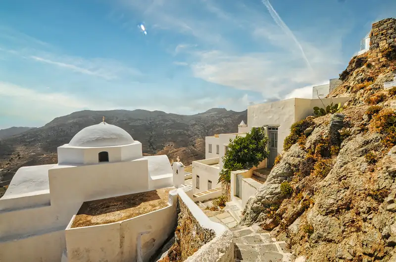Cycladic homes and a chapel built into the hillside of Chora