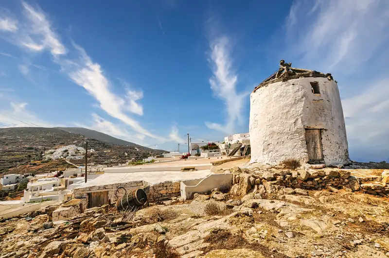 Whitewashed windmill above the village of Kastro in Sikinos